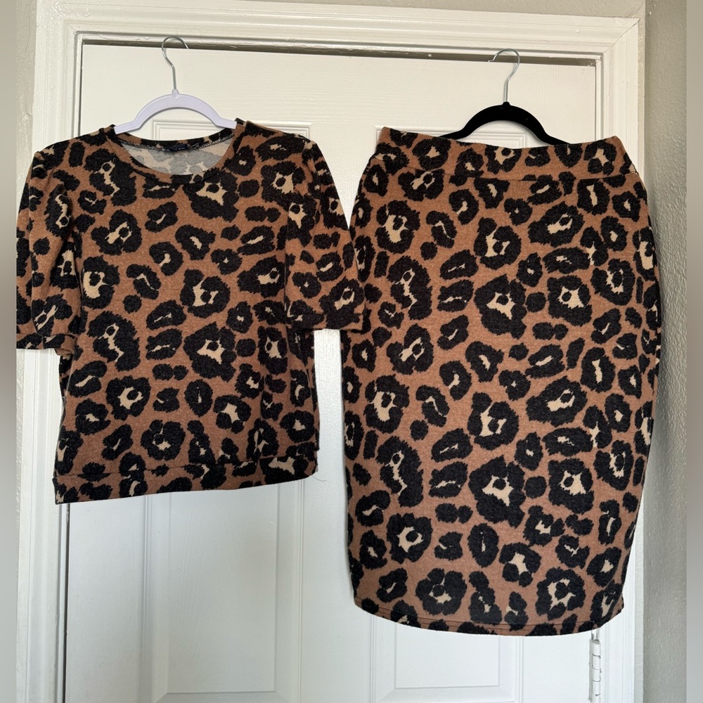 Brand lark and Grey size large, color brown and black animal print
